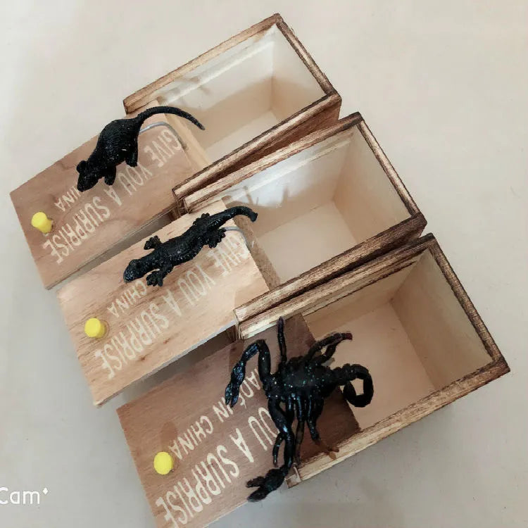 Wooden prank scare box with jumping spider surprise for April Fools jokes