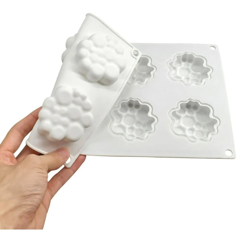 Round silicone baking mould with 8-bubble patterned base for cakes and desserts.