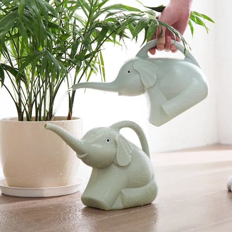 Blue elephant-shaped children's plastic watering can with a long nozzle and ergonomic handle.