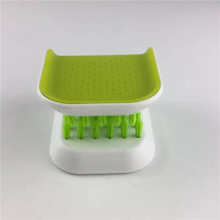 Blue U-shaped plastic brush for cleaning kitchen knives and forks.