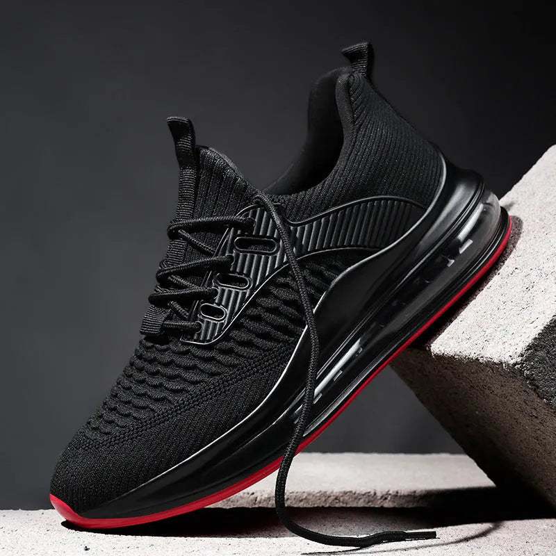 Men's low-top black mesh running shoes with white sole and lace-up front.