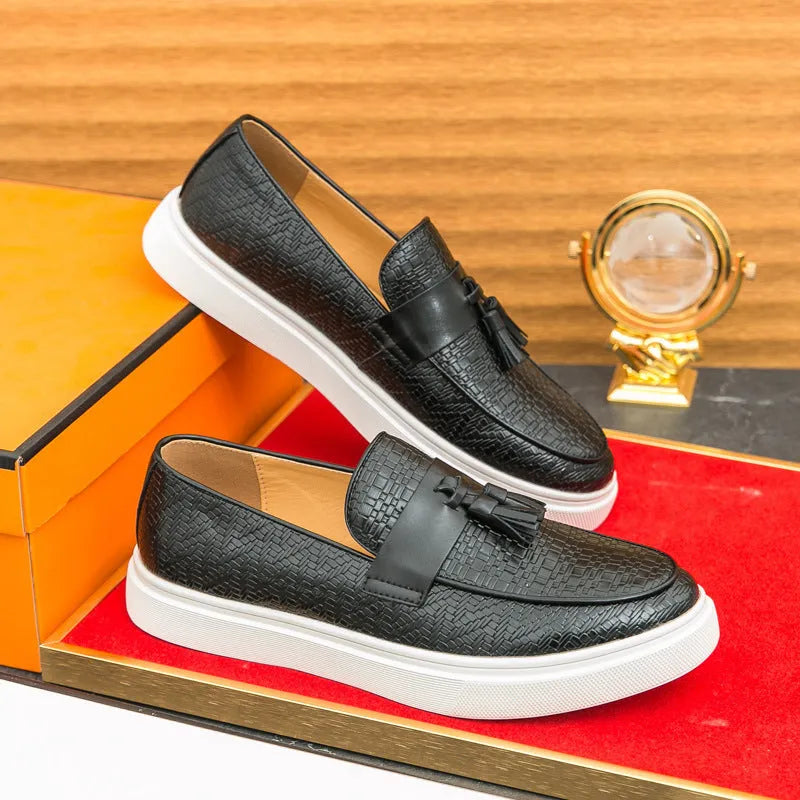Men's black casual leather shoes with fringe detail on round toe, low heel.
