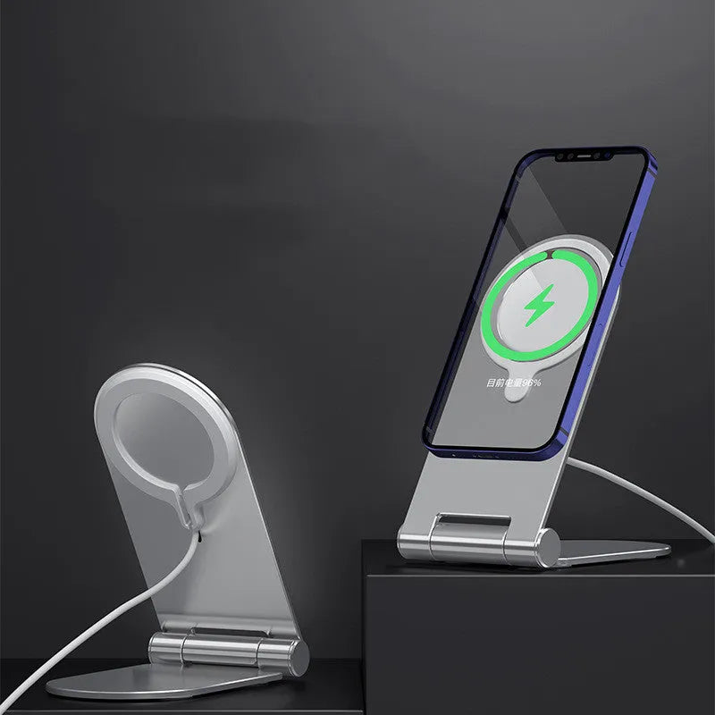 Silver portable magnetic phone bracket for iPhone 12 shown on a car dashboard.