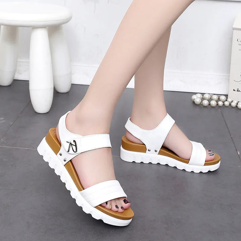 Women's white fish mouth wedge heel sandals with ankle strap on beach