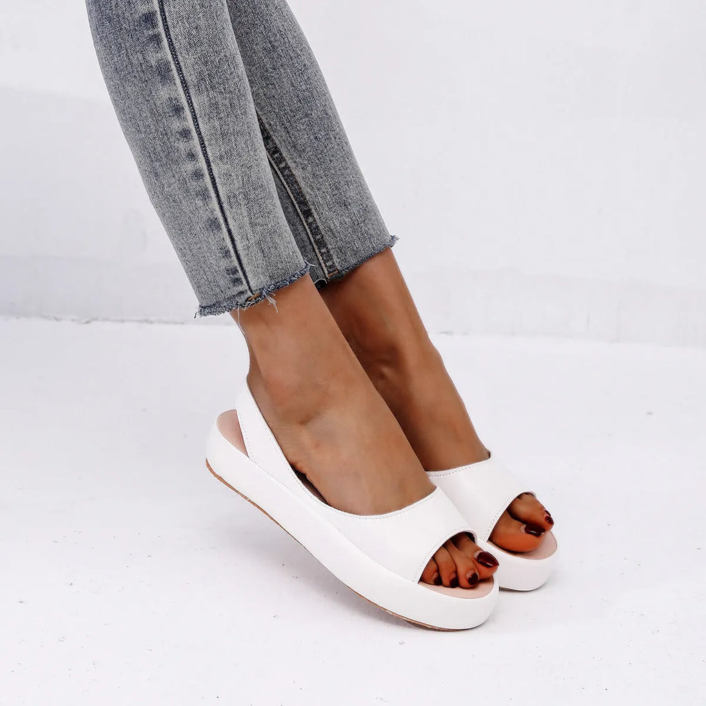 Women's summer fish mouth flat sandals in solid colour with back strap design, side hollow detail, artificial PU upper, rubber sole