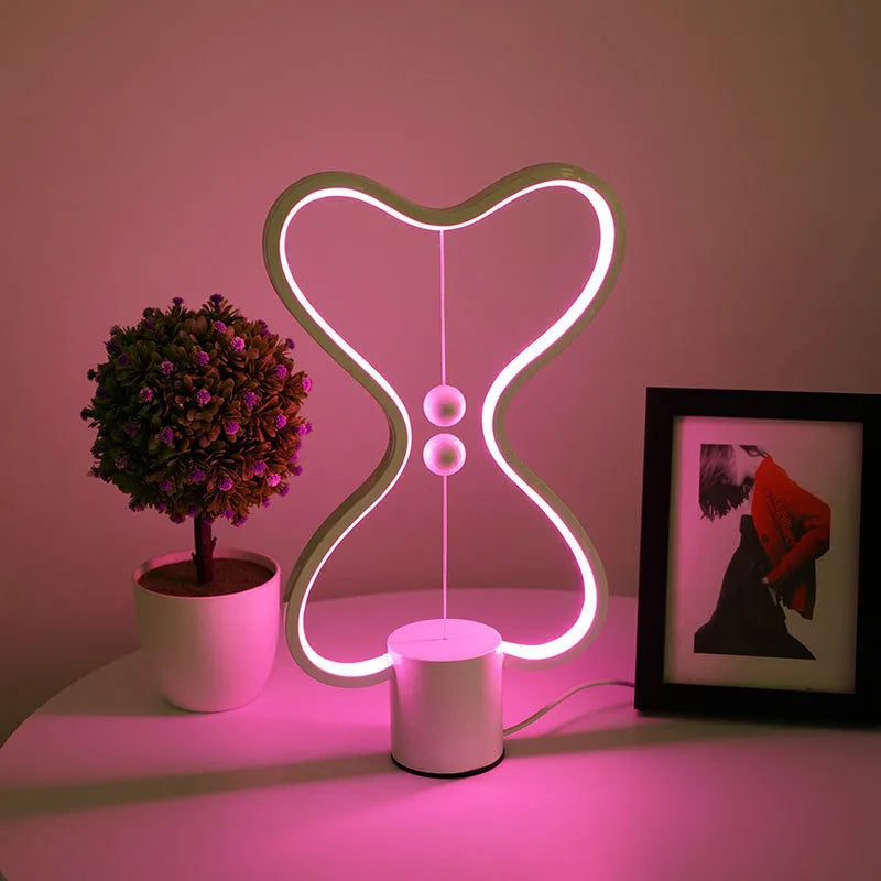LED balance night lamp with 7 colour options, USB powered, showing suspended netball design