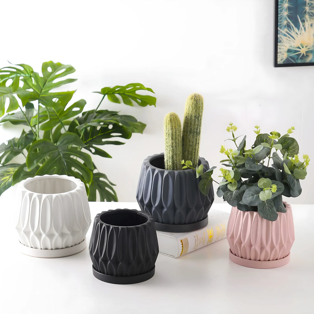 Medium grey ceramic tabletop plant pot for flowers and green plants