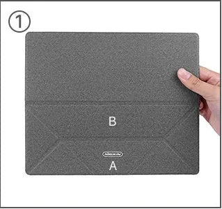 Blue portable laptop cooling bracket with foldable design on a wooden table.