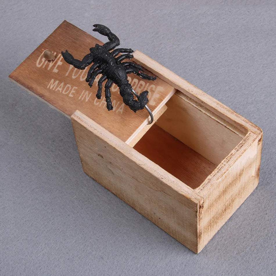 Wooden prank scare box with jumping spider surprise for April Fools jokes