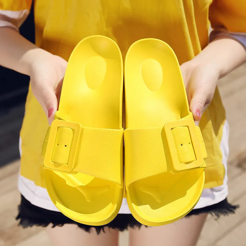 Women's grey blue buckle strap sandals with a soft EVA sole on a light background.