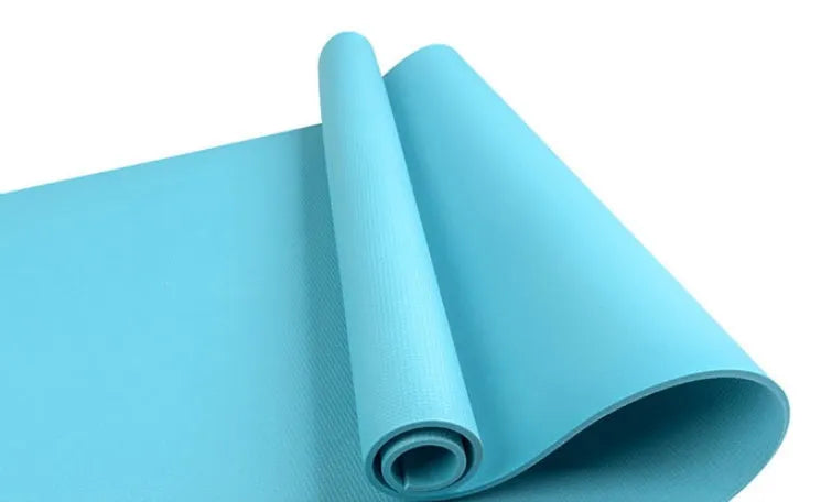 Red EVA fitness yoga mat with rolled edge showing thickness, alongside a blue mat and OPP storage bag.