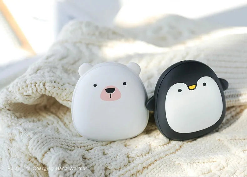 Cartoon penguin and polar bear USB rechargeable electric hand warmers showing dual-sided heating design