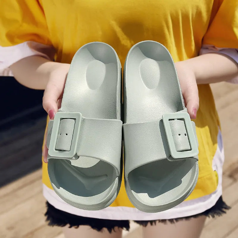 Women's grey blue buckle strap sandals with a soft EVA sole on a light background.
