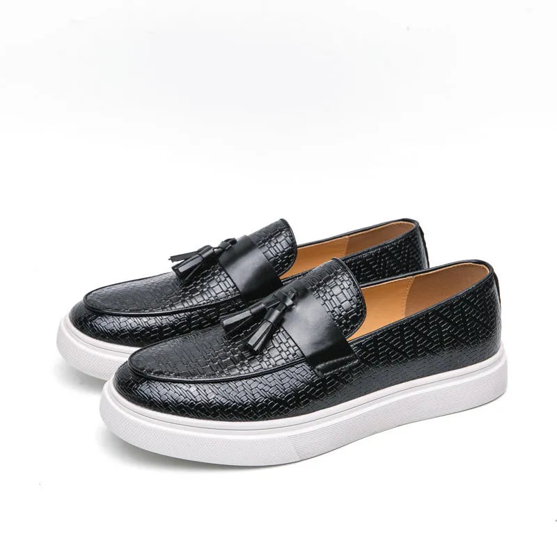 Men's black casual leather shoes with fringe detail on round toe, low heel.
