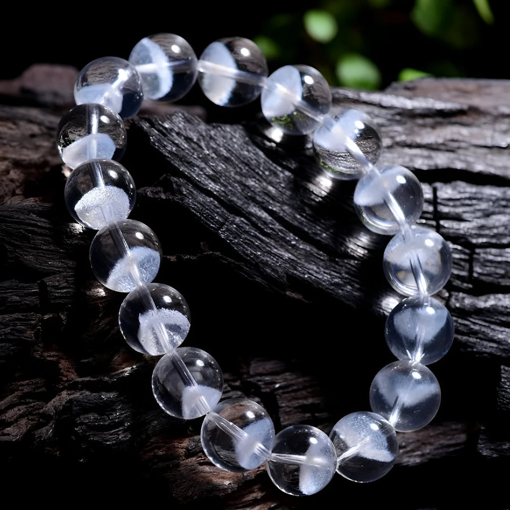 Women's white crystal bracelet with a ghost pyramid centrepiece and a traditional Ruyi charm.