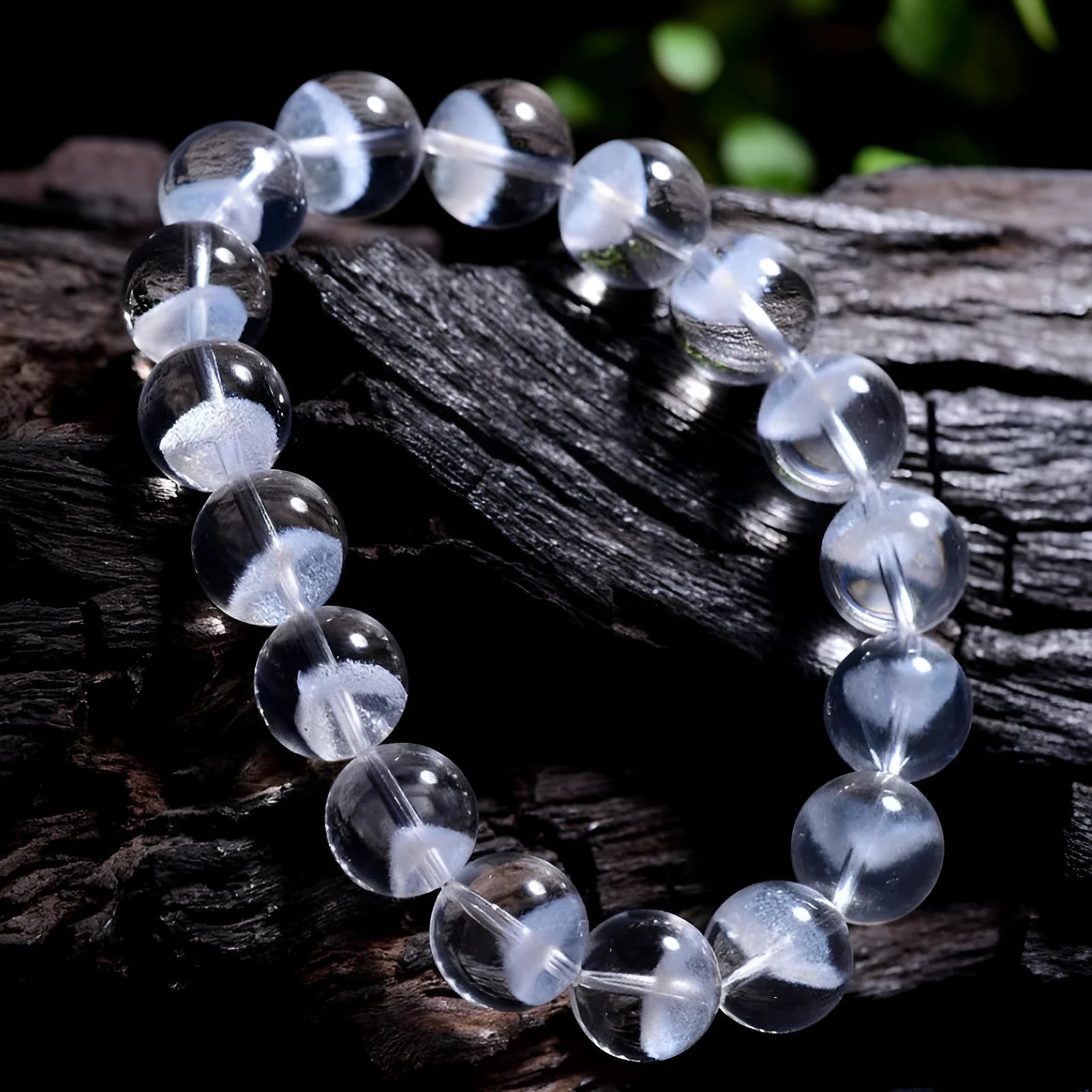 Women's white crystal bracelet with a ghost pyramid centrepiece and a traditional Ruyi charm.