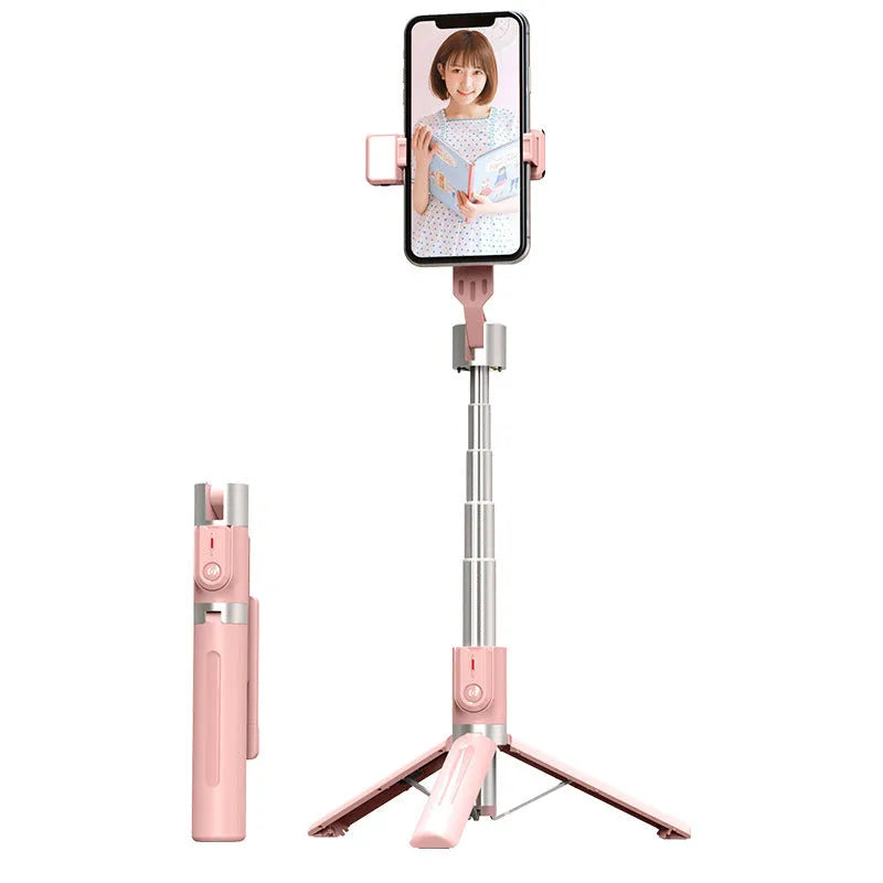 Black aluminium Bluetooth selfie stick with dual fill lights extended on a desktop.