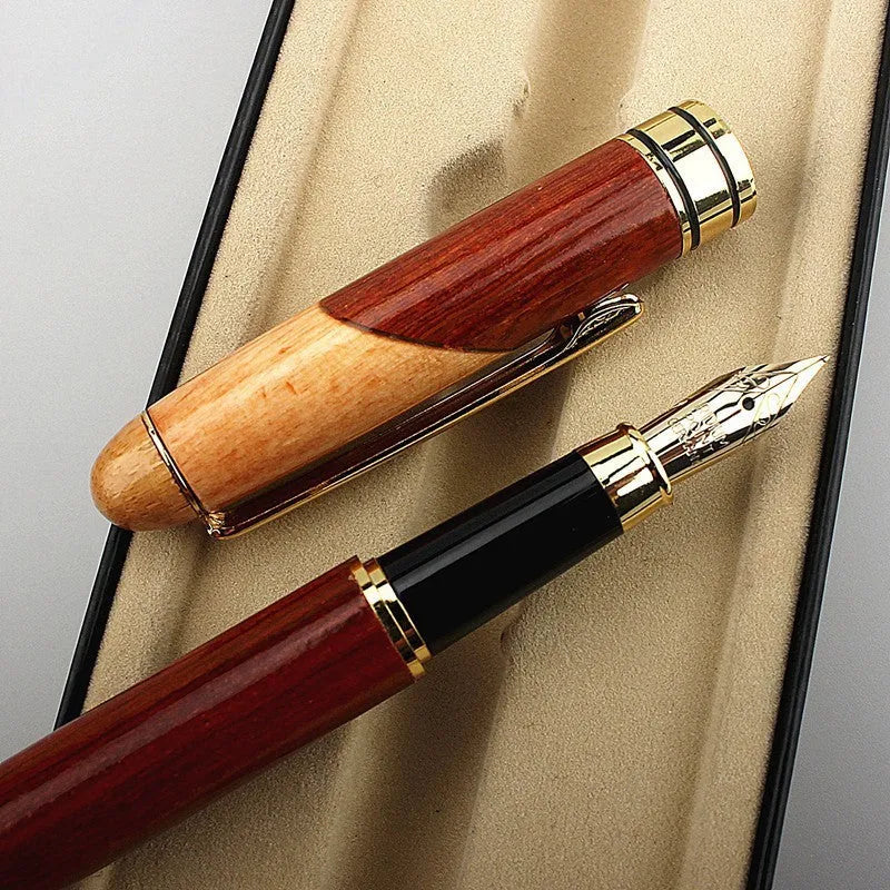 Wooden ballpoint pen with metal details shown alongside its grey fabric carrying bag.