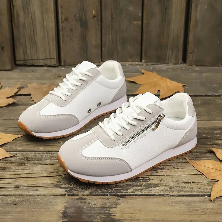 Women's flat-heeled shoe in artificial PU, available in grey, white, and champagne, with a rubber sole