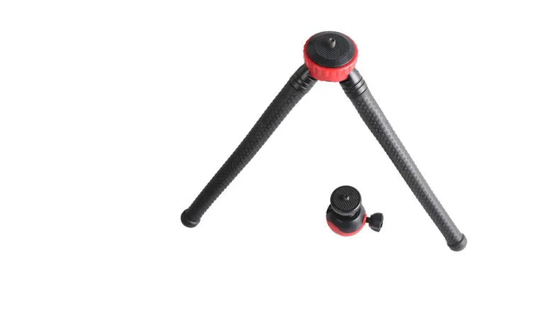 Black octopus tripod with spherical gimbal head wrapped around pole supporting mobile phone