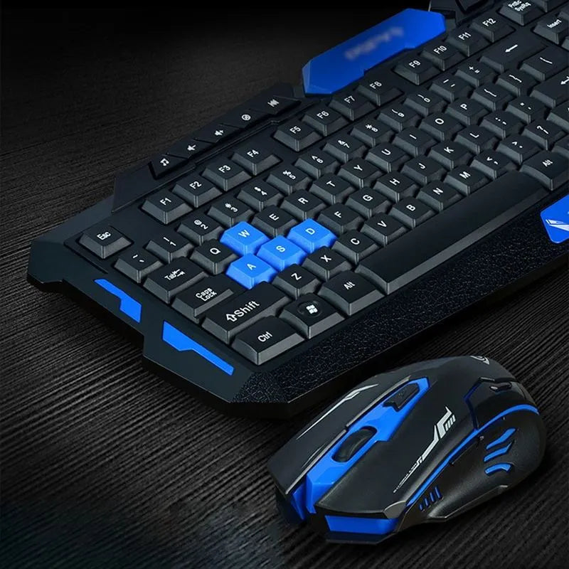 Black and blue wireless keyboard and mouse set on a desk, showing full-size keyboard and ergonomic mouse.