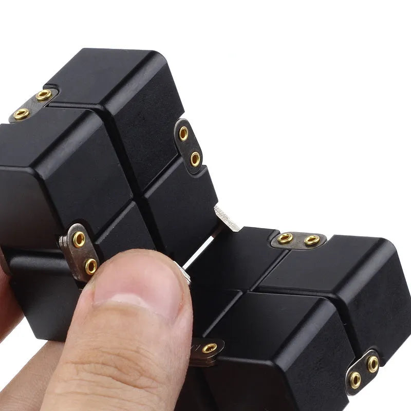 Zinc alloy infinity cube fidget toy in black finish showing rotating cube mechanism