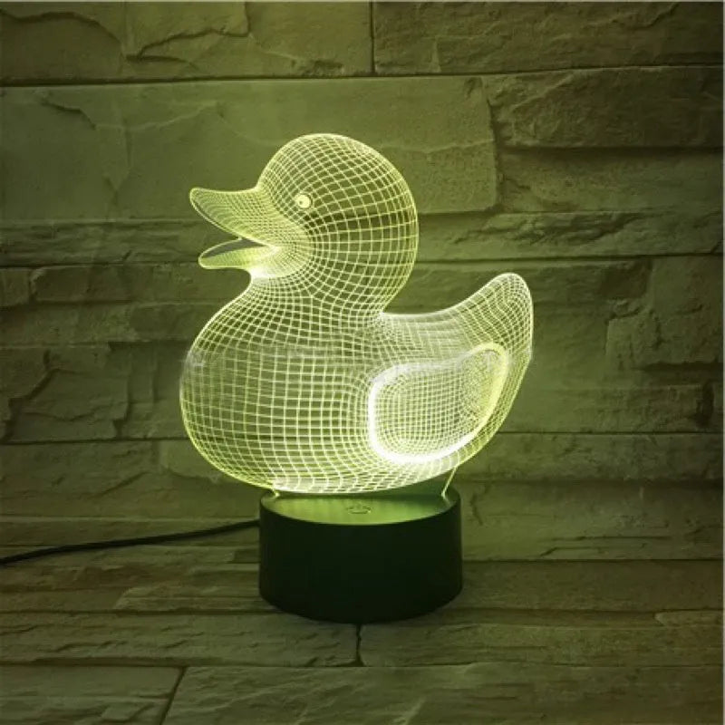 Yellow 3D duck night light with remote control on bedside table showing multiple colour options