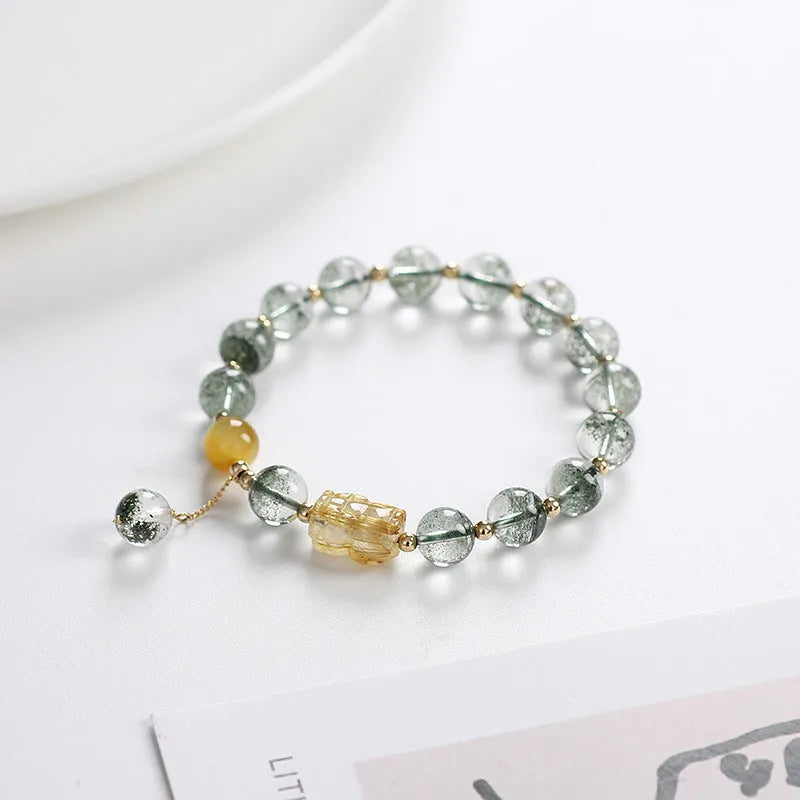 Green phantom quartz crystal bracelet with gold rutile needles and 8mm geometric beads