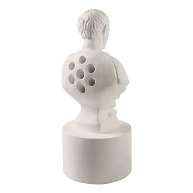 White synthetic resin American character modelling pen holder on a desk
