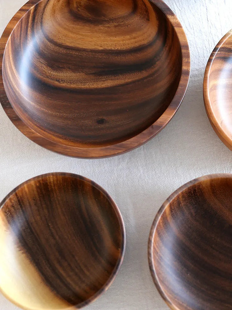 Natural brown wooden bowl with wood grain, overglaze finish, 12x6cm, on a table