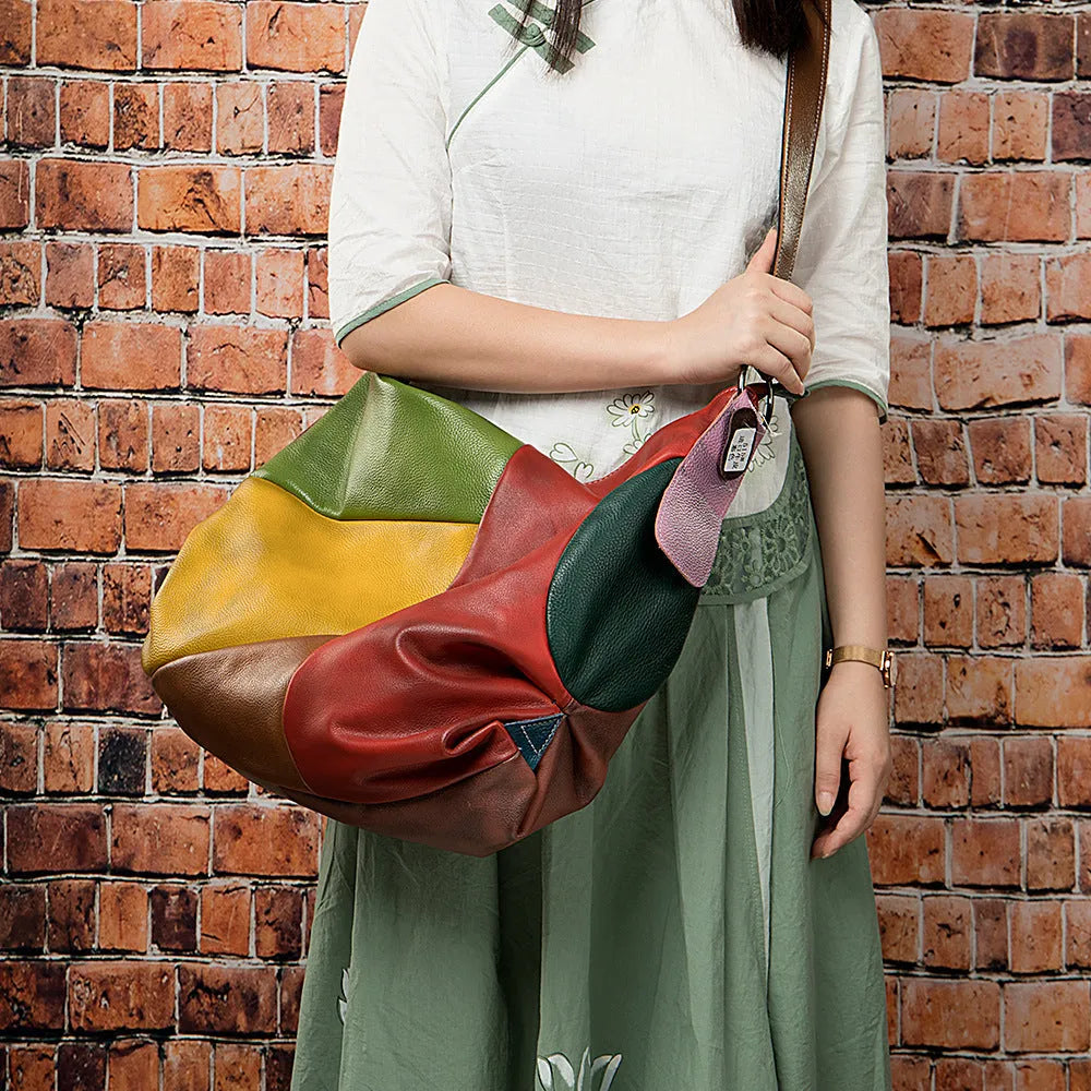 Brown cowhide leather crossbody travel bag with dimensions 48cm by 15cm by 37cm.