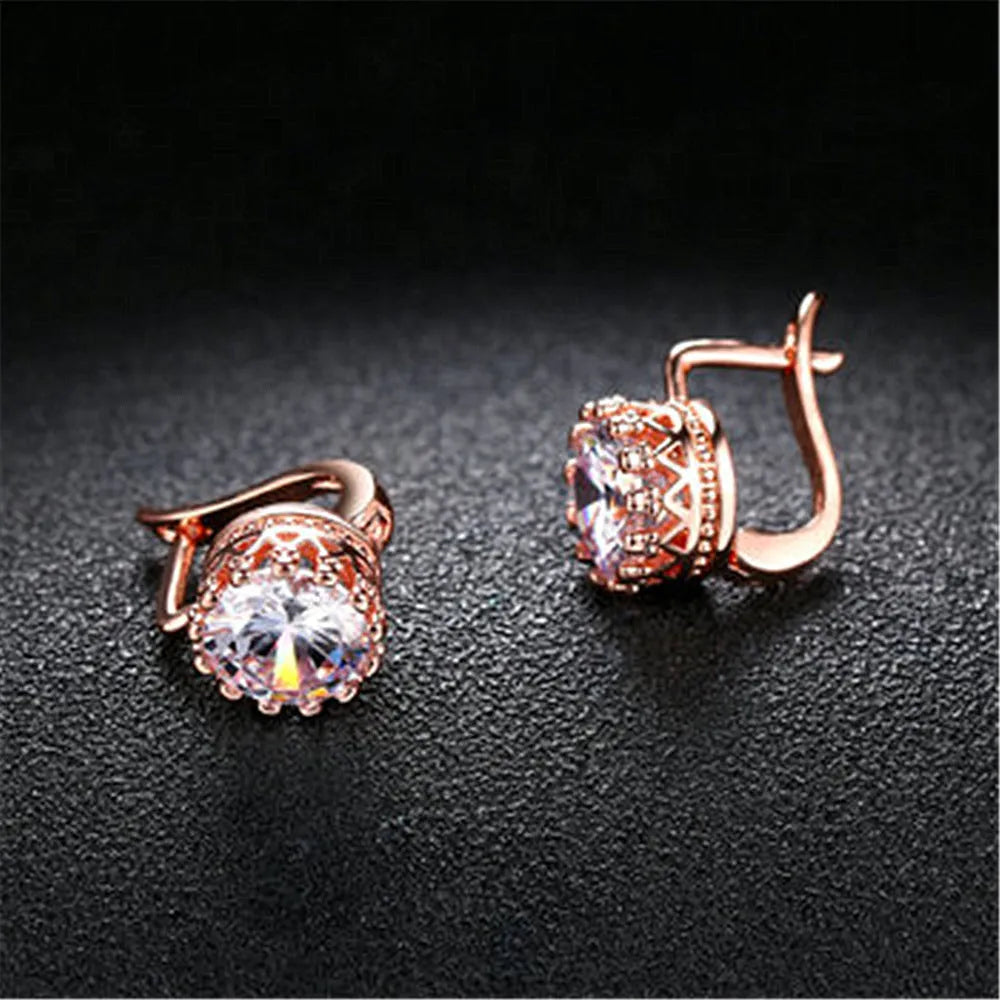Crown-shaped clip-on earrings with white diamond details in rose gold or white gold colour finish