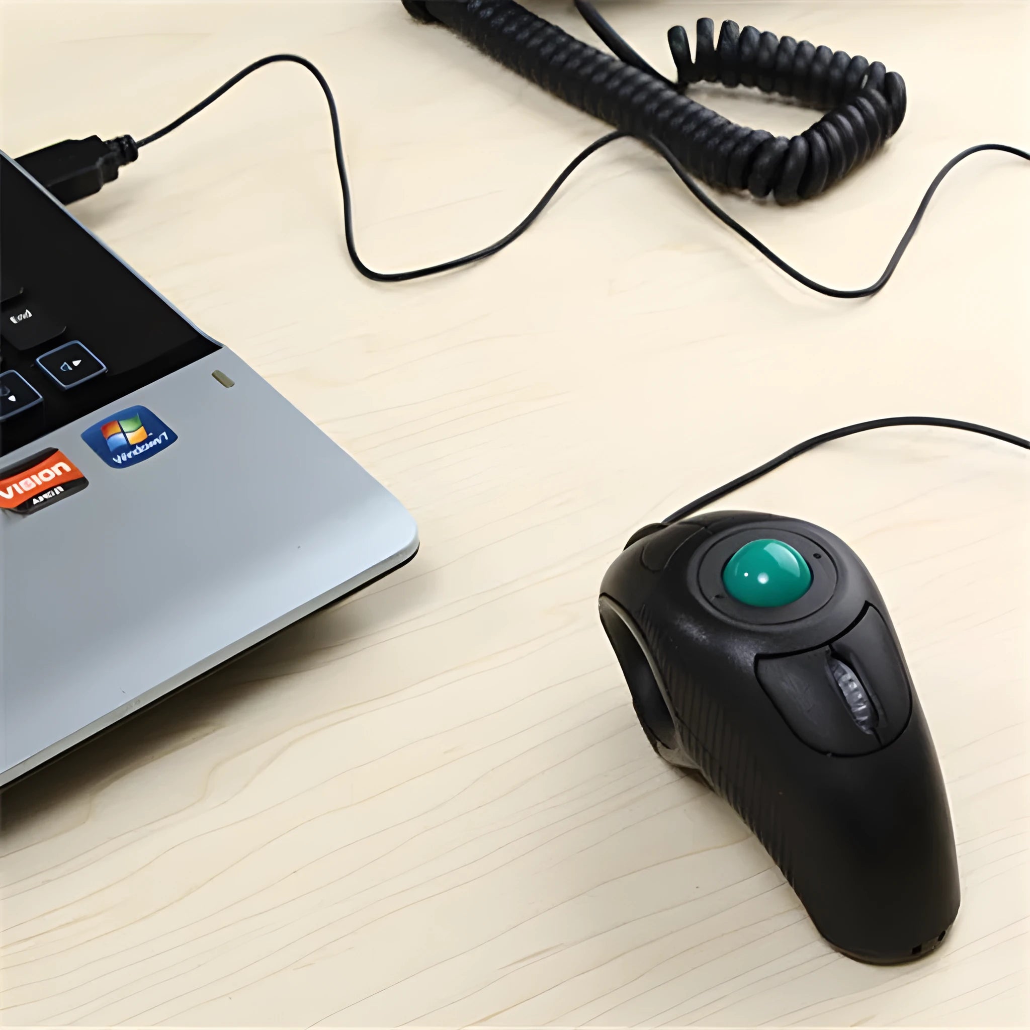 Black wireless trackball mouse with six buttons and USB receiver for laptop use
