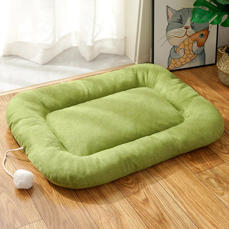 Brown and green universal dog cushion shown in four sizes for kennel sleeping and summer cooling