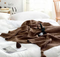 Nordic fringed knit ball blanket in acrylic measuring 130×170cm in beige colour