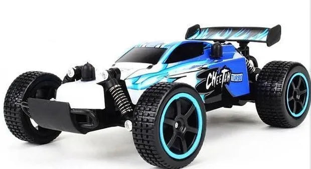 Blue 1:18 scale remote control drift car with 2.4GHz transmitter on a hard surface