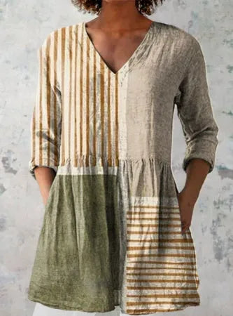Women's loose-fitting long dress with a blue wave pattern print and 3/4 sleeves.