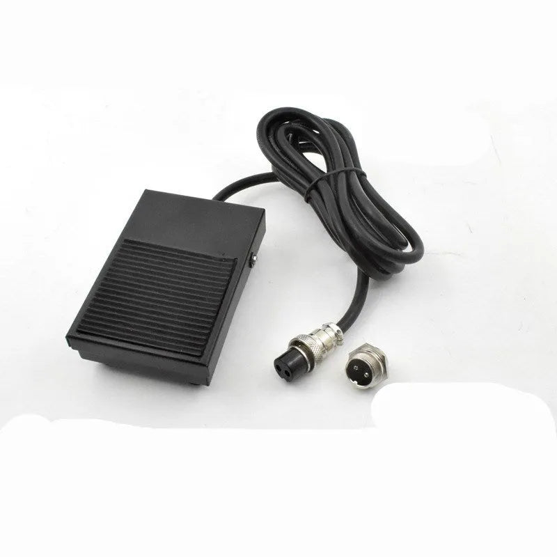 Metal welding machine foot switch with rubber pedals and a long black cable.