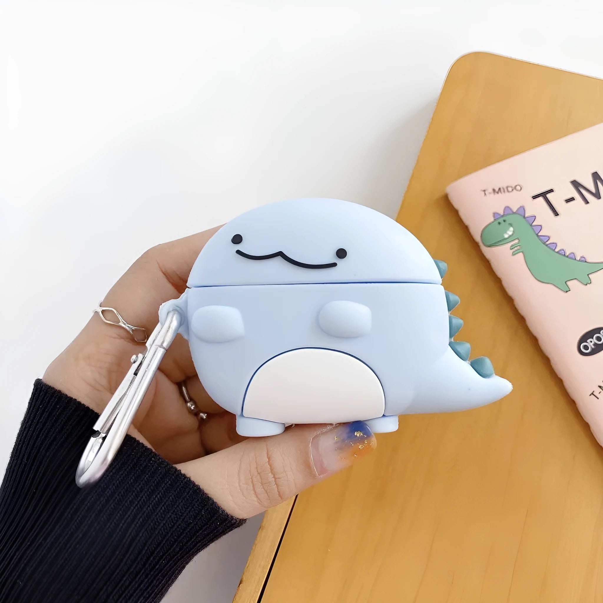 Blue silicone AirPods case with baby dragon design for Apple AirPods models 1, 2 and 3