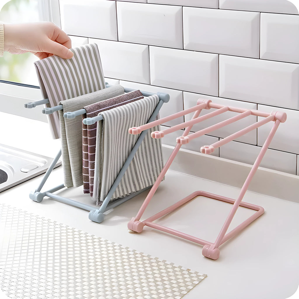 Foldable plastic towel shelf with vertical storage in light pink Nordic kitchen organiser