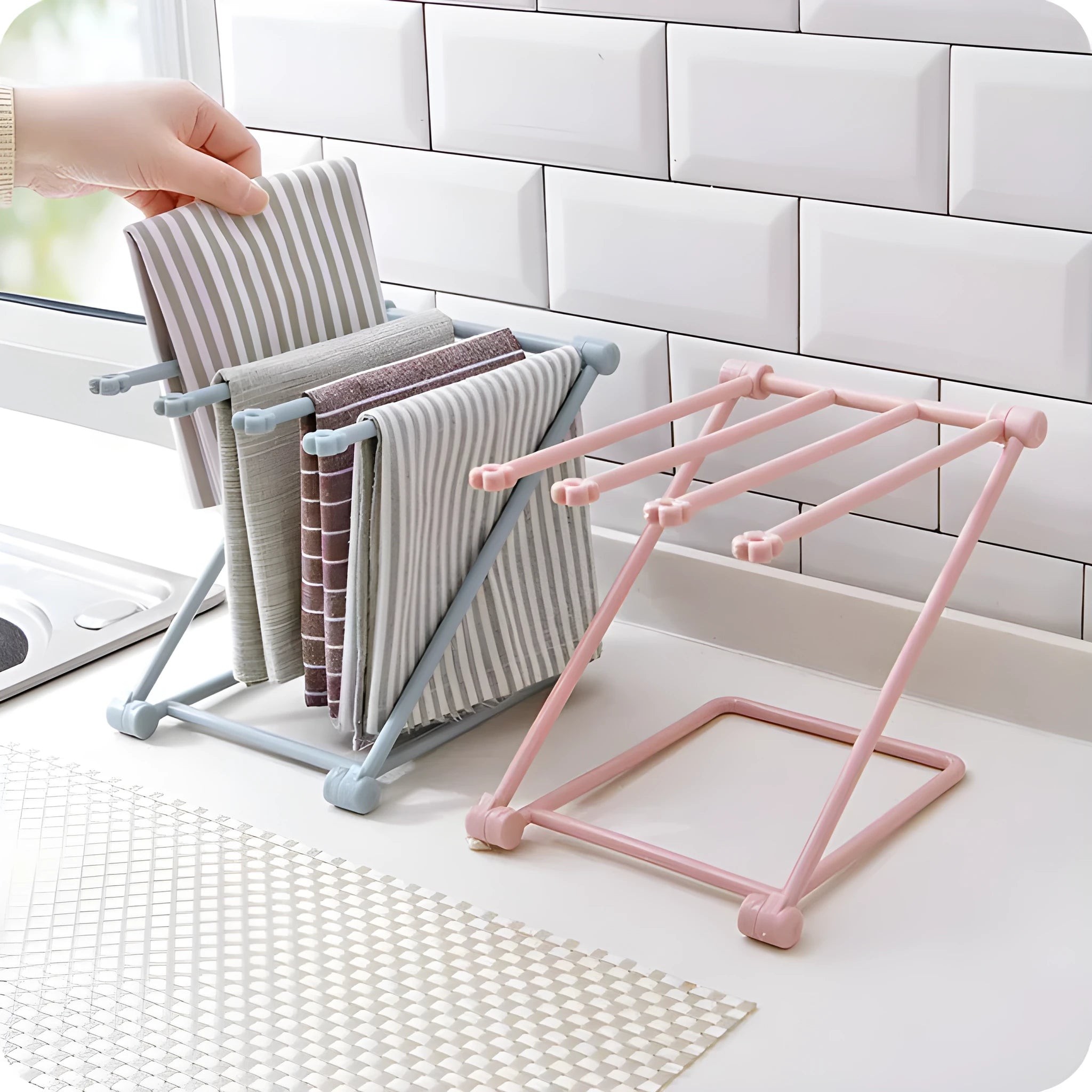 Foldable plastic towel shelf with vertical storage in light pink Nordic kitchen organiser