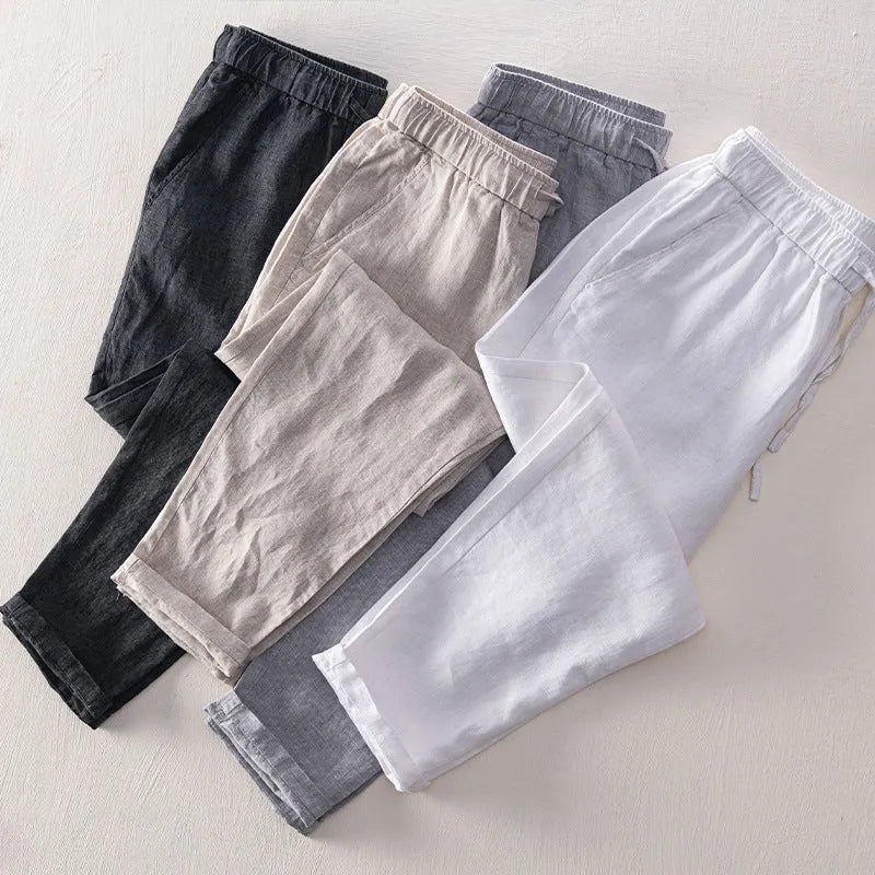 Men's linen straight leg trousers in light grey showing mid-waist design and straight cut