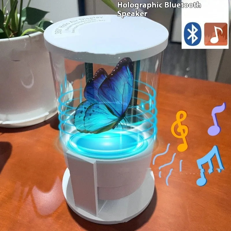White 360-degree 3D holographic fan Bluetooth speaker with cylindrical screen on a desk