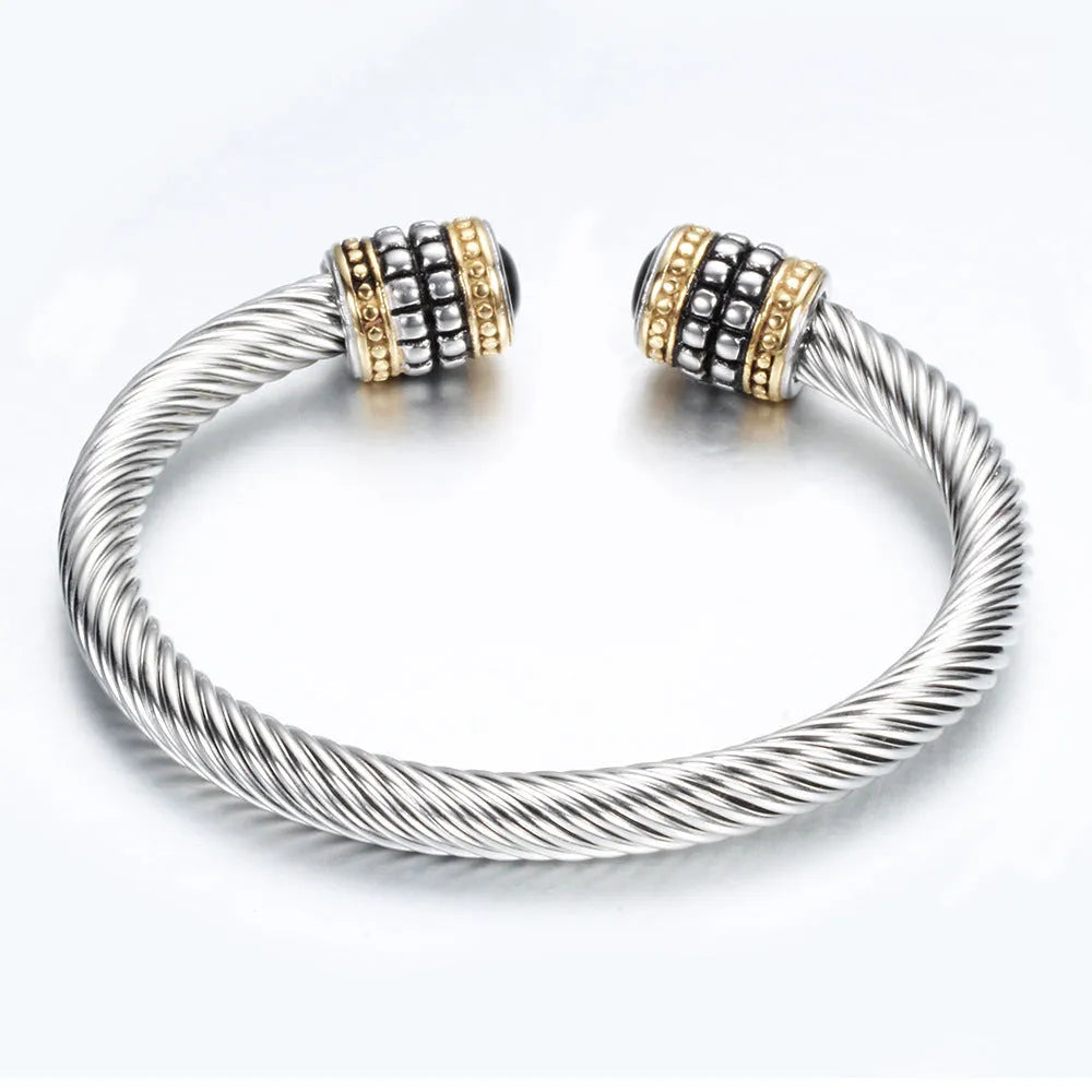 Two-tone vintage gold stainless steel bangle bracelet in black and golden finish
