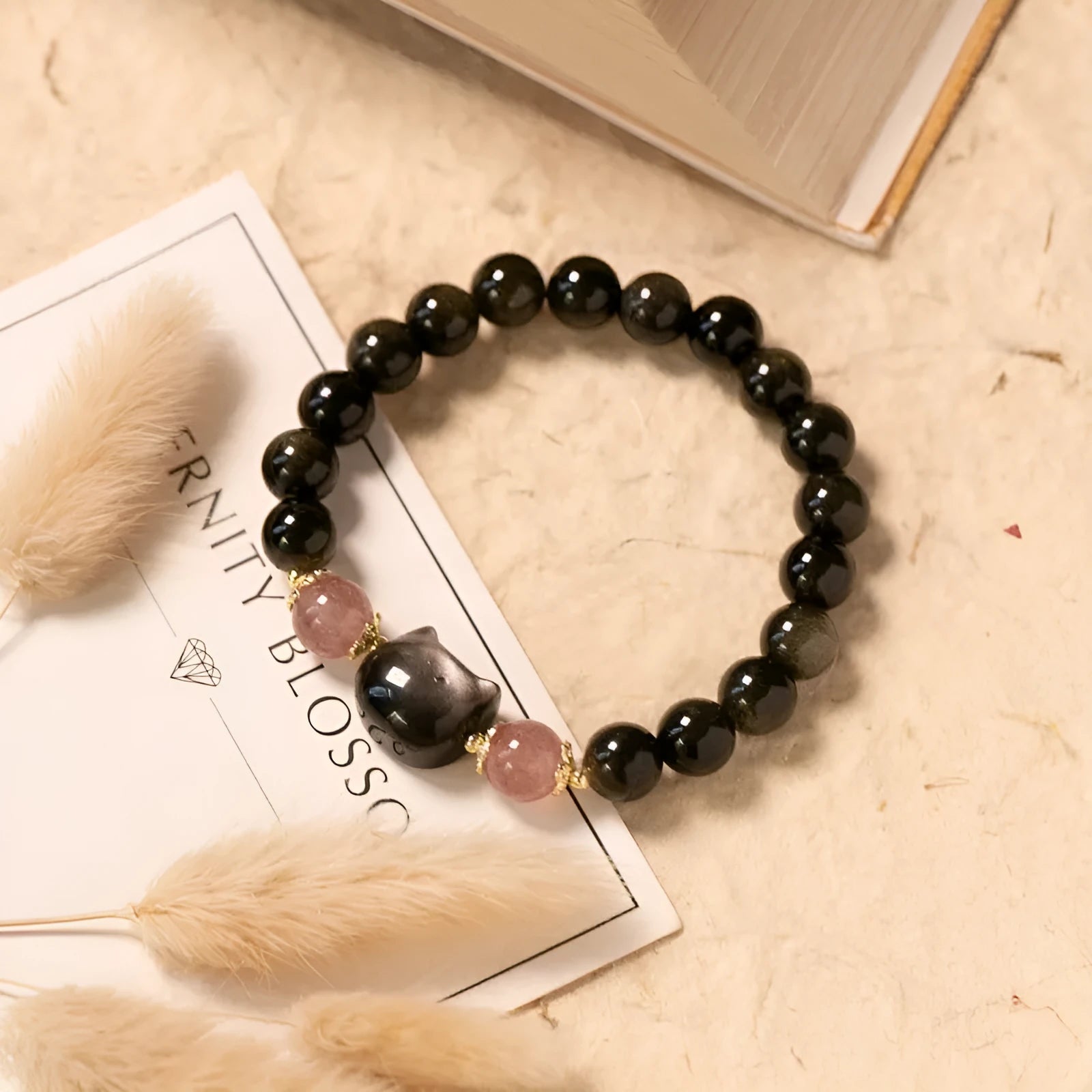 Black obsidian bracelet with 8mm stones and kitty charms on adjustable cord