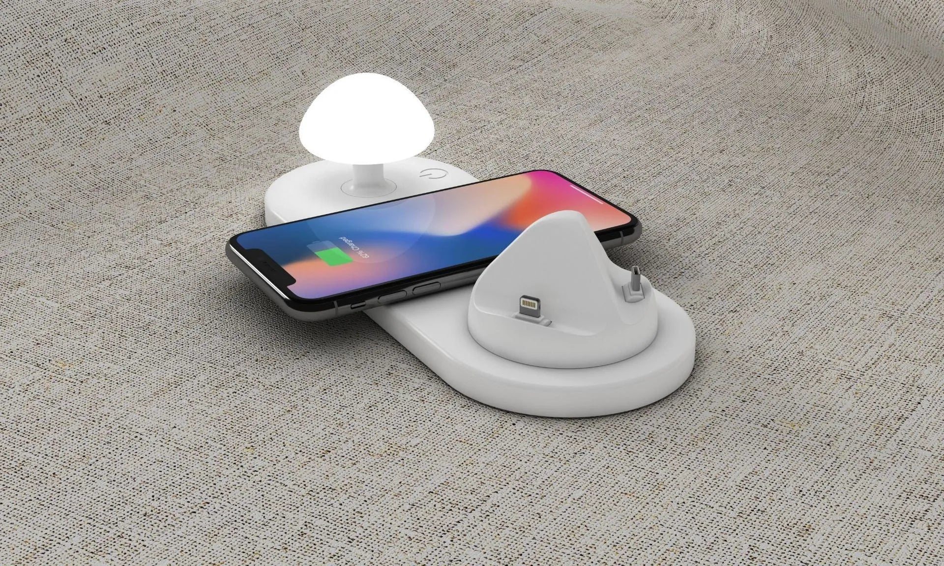 White 3 in 1 wireless charging dock with a phone on the pad and USB cable