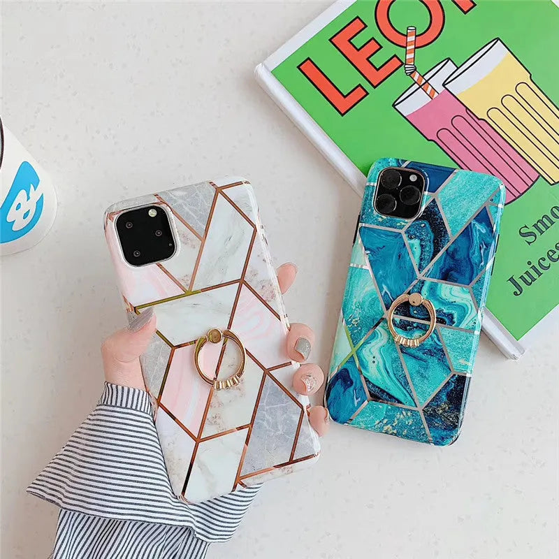 Geometric patterned purple TPU iPhone case with a silver metal bracket ring attached to the back.