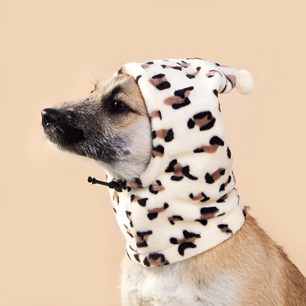 Cloth pet headgear with rabbit ears on a dog, in leopard print, with adjustable strap.