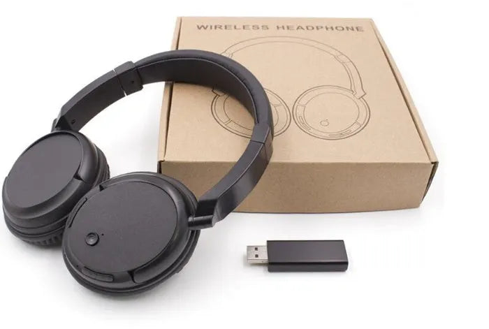 Black stereo wireless headset with USB FM transmitter and 3.5mm audio cable for wired connection.