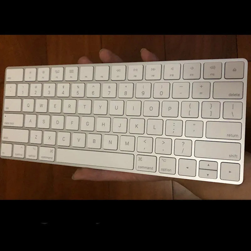 Brand new white Apple Bluetooth G6 wireless keyboard with multimedia keys in metal box.